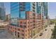 Brick and glass exterior of modern high-rise building at 1700 Bassett St # 1008, Denver, CO 80202