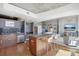 Modern kitchen with stainless steel appliances, black subway tile backsplash, and seating at island at 1700 Bassett St # 1008, Denver, CO 80202