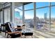 Sunlit living area with expansive windows offering panoramic views of the city skyline at 1700 Bassett St # 1008, Denver, CO 80202