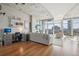 Modern living room with hardwood floors and city views at 1700 Bassett St # 1008, Denver, CO 80202