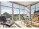 Bright living and dining area featuring a glass dining table, city view and comfortable seating at 1700 Bassett St # 1008, Denver, CO 80202