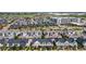 Expansive aerial view of a residential neighborhood with varied home styles and green spaces at 5744 Alton St, Denver, CO 80238