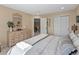 Bedroom with a double closet, a dresser, and lots of natural light at 7292 Tenby Way, Castle Pines, CO 80108