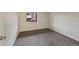 Carpeted bedroom with window for natural light at 4691 S Decatur St # 212, Englewood, CO 80110