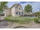 Back yard featuring a well-maintained lawn, a concrete patio, and a deck with stairs at 9882 Harris St, Thornton, CO 80229