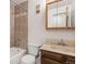 Updated bathroom featuring a tiled shower and tub, a vanity, and modern fixtures at 6505 Kalua Rd # 204B, Boulder, CO 80301