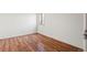 Bright bedroom featuring hardwood floors and a window for natural light at 6505 Kalua Rd # 204B, Boulder, CO 80301