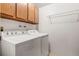 Dedicated laundry room with washer, dryer, and upper cabinets for storage at 6505 Kalua Rd # 204B, Boulder, CO 80301