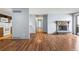 An inviting living room features new hardwood floors, a cozy fireplace, and seamless transitions to a kitchen area at 6505 Kalua Rd # 204B, Boulder, CO 80301