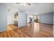 Open-concept living room connects to kitchen area with a cozy fireplace and easy access to a balcony at 6505 Kalua Rd # 204B, Boulder, CO 80301