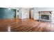 A spacious living room features hardwood floors, a fireplace, and seamlessly connects to the kitchen for entertaining at 6505 Kalua Rd # 204B, Boulder, CO 80301