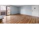 Bright living room with hardwood floors and access to a private balcony perfect for enjoying the outdoors at 6505 Kalua Rd # 204B, Boulder, CO 80301
