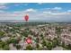 Aerial view of a neighborhood near Chatfield Reservoir, highlighting the community's location and proximity to water at 9620 W Chatfield Ave # D, Littleton, CO 80128