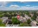 An aerial shot of a neighborhood surrounded by lush trees and greenery at 9620 W Chatfield Ave # D, Littleton, CO 80128