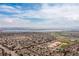 Wide aerial view of a town and lake on a bright day at 9620 W Chatfield Ave # D, Littleton, CO 80128