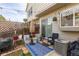 Backyard patio with outdoor seating, string lights and decorative plants at 9620 W Chatfield Ave # D, Littleton, CO 80128