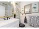 Bathroom featuring marble countertops, modern vanity, and decorative mirrors and decorations at 9620 W Chatfield Ave # D, Littleton, CO 80128