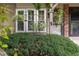 Close-up of an adorned front entrance with lush greenery and decorative accents at 9620 W Chatfield Ave # D, Littleton, CO 80128