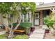 Inviting home entrance featuring a cozy bench and a decorative door wreath at 9620 W Chatfield Ave # D, Littleton, CO 80128