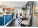 Charming kitchen with a dining area, showcasing modern appliances and tasteful decor with views to the backyard at 9620 W Chatfield Ave # D, Littleton, CO 80128
