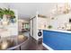 Open kitchen flowing into the living areas and featuring modern appliances, cabinetry and stylish accents at 9620 W Chatfield Ave # D, Littleton, CO 80128