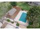 Aerial view of a fenced in outdoor pool covered with a blue tarp at 9620 W Chatfield Ave # D, Littleton, CO 80128