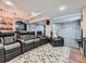 Finished basement with theater seating, a bar, and a climbing wall, perfect for entertaining at 2896 Gemini Loop, Broomfield, CO 80023