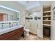 Modern bathroom with double vanity, glass shower, and stylish tile work, offering a luxurious feel at 2896 Gemini Loop, Broomfield, CO 80023