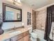Bathroom featuring a shower-tub combo, granite countertop vanity, and modern fixtures at 2896 Gemini Loop, Broomfield, CO 80023
