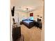 Neutral bedroom with a platform bed, modern lighting, and a dedicated desk area at 2896 Gemini Loop, Broomfield, CO 80023