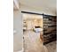 View of a bedroom featuring a decorative sliding barn door entrance and elegant chandelier lighting at 2896 Gemini Loop, Broomfield, CO 80023