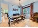 Elegant dining room featuring a wooden table, chandelier, and hardwood floors, perfect for gatherings and meals at 2896 Gemini Loop, Broomfield, CO 80023