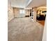 Spacious recreation room with a climbing wall, seating area, and neutral decor at 2896 Gemini Loop, Broomfield, CO 80023