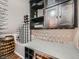 Chic wine room with custom wine racks, elegant lighting, and a countertop for serving at 2896 Gemini Loop, Broomfield, CO 80023