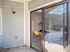 Balcony with glass sliding doors, allowing views of the bedroom at 5690 W 80Th Pl # 101, Arvada, CO 80003