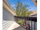 Balcony featuring black metal railings and partial tree coverage at 5690 W 80Th Pl # 101, Arvada, CO 80003