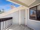 Balcony with railing, door, and window offering scenic views at 5690 W 80Th Pl # 101, Arvada, CO 80003