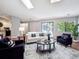 Living room with contemporary furnishings, and a sliding glass door to a balcony at 5690 W 80Th Pl # 101, Arvada, CO 80003