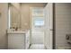 Contemporary bathroom featuring stylish vanity and an open doorway to another room at 1919 Eaton St, Lakewood, CO 80214