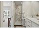 Updated bathroom features glass-enclosed shower and modern vanity at 1919 Eaton St, Lakewood, CO 80214