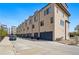Modern townhomes with a sleek design, individual garages, and well-maintained surroundings at 1919 Eaton St, Lakewood, CO 80214