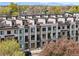 Contemporary townhome complex featuring modern architecture, clean lines, and private balconies at 1919 Eaton St, Lakewood, CO 80214