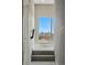 Stairway with steps and window showing city skyline view at 1919 Eaton St, Lakewood, CO 80214