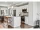 Well-equipped kitchen with a breakfast bar, stainless steel appliances, and stylish white cabinetry at 1919 Eaton St, Lakewood, CO 80214