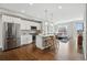 Modern kitchen boasts white cabinets, stainless steel appliances, and a center island, blending style with functionality at 1919 Eaton St, Lakewood, CO 80214