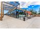 Syrup Restaurant exterior featuring a modern facade, outdoor seating, and attractive landscaping at 1919 Eaton St, Lakewood, CO 80214