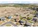 High aerial shot showing the home, backyard, and surroundings with beautiful vegetation at 1294 Kittery St, Castle Rock, CO 80104