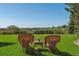 Serene backyard featuring a well-manicured lawn, seating area, and beautiful views at 1294 Kittery St, Castle Rock, CO 80104