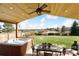 Back patio featuring a hot tub and outdoor dining area with beautiful views at 1294 Kittery St, Castle Rock, CO 80104