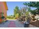 Serene backyard retreat with lush landscaping, seating areas, and a charming stone pathway at 1294 Kittery St, Castle Rock, CO 80104
